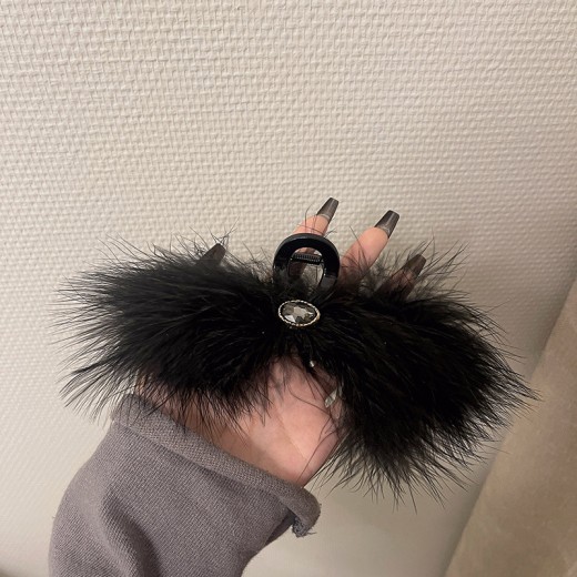 Feather Grabbing Ostrich Feathers On The Back Of The Head