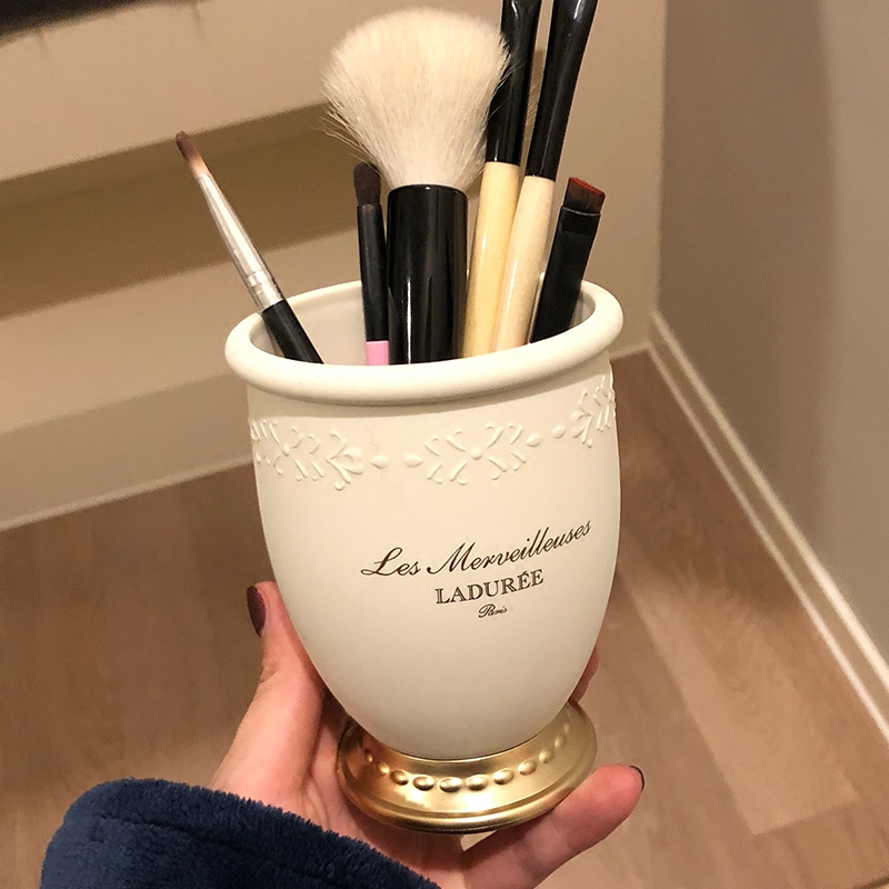 Embossed makeup brush tube
