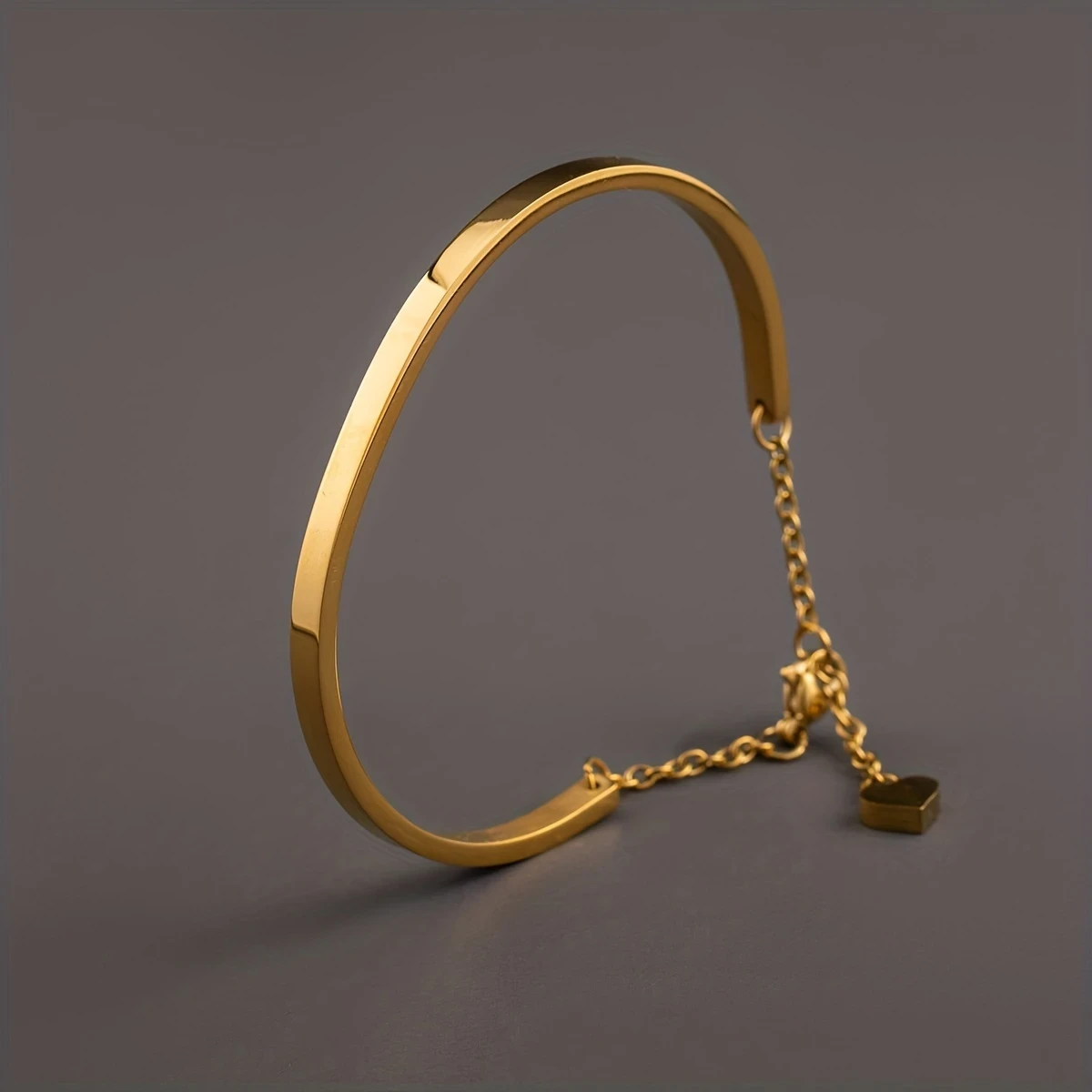 Golden-Plated Stainless Steel Heart Pendant Bracelet with Chain Extension  Unisex Fashion Accessory for Men and Women, Perfect for Couples or Casual Attire