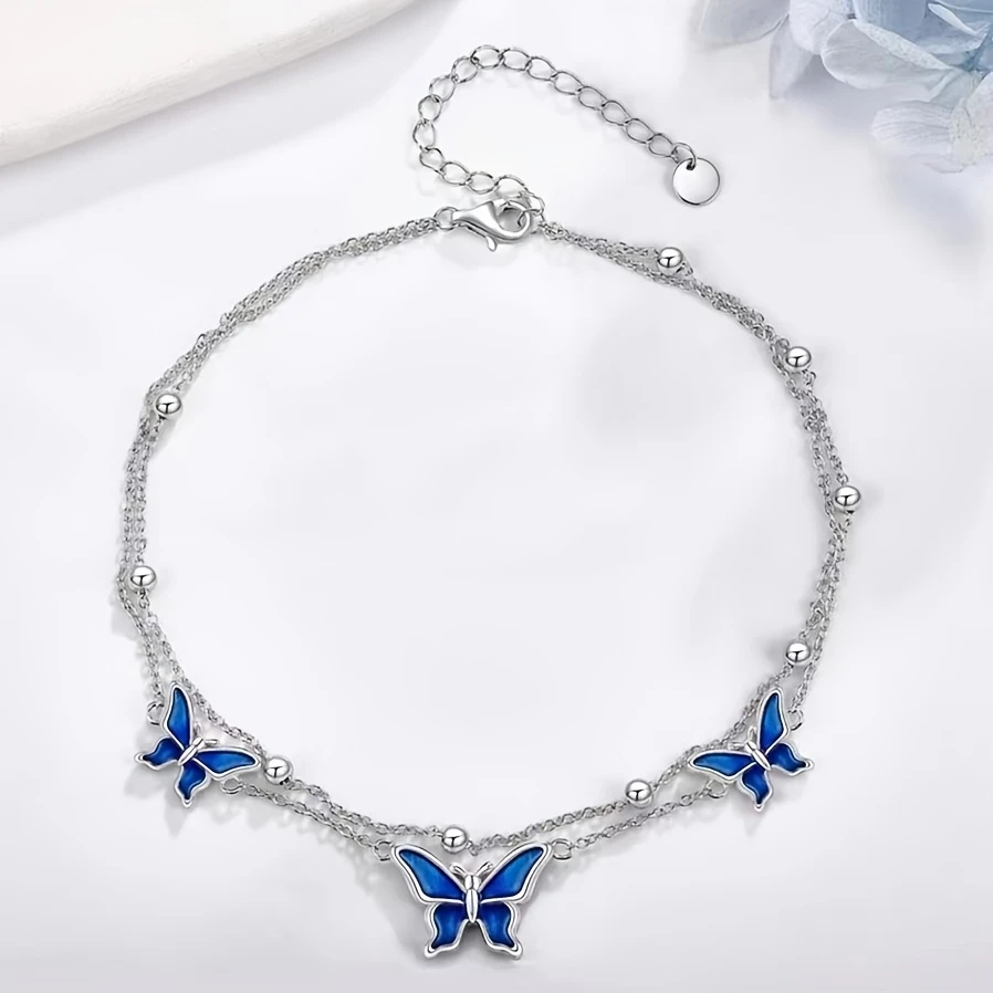 White Golden Butterfly Anklet Elegant White Golden-Plated Copper Butterfly Anklet with Blue Enamel Accents