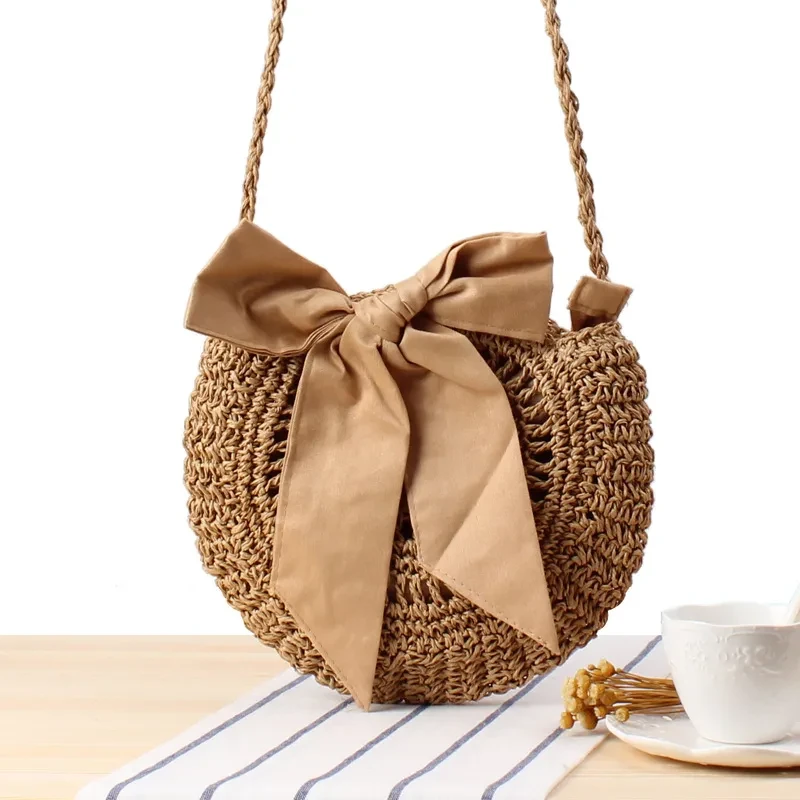 Straw bow crossbody woven bag